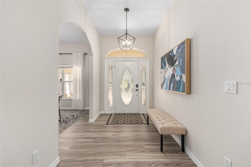 Foyer toward front door, chandelier