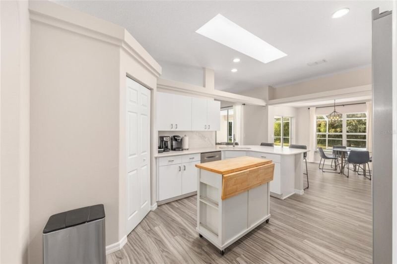 Kitchen toward breakfast nook, skylight