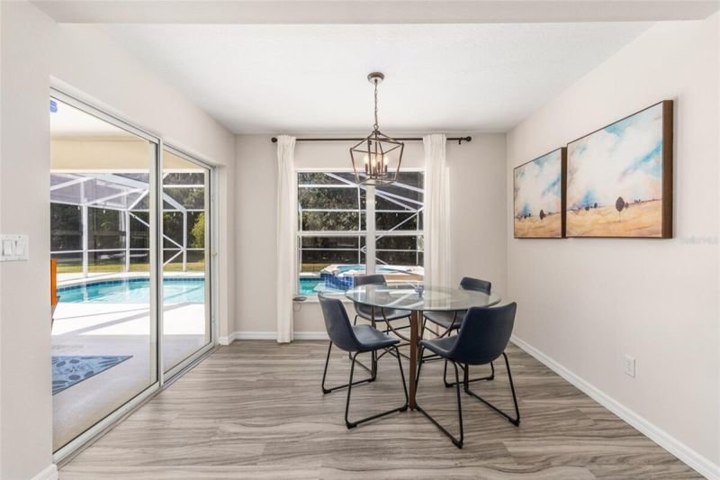 Breakfast nook with sliders to the pool