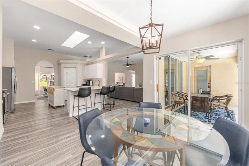 Great room toward lanai, glass table