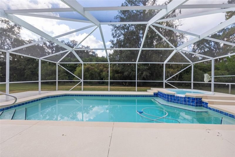 Pool + spa, blue tile, view to yard