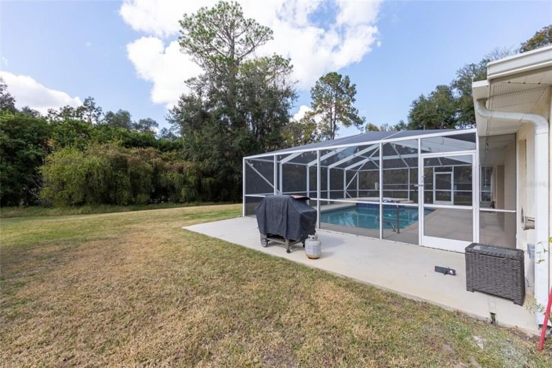 The screen enclosure from the side yard