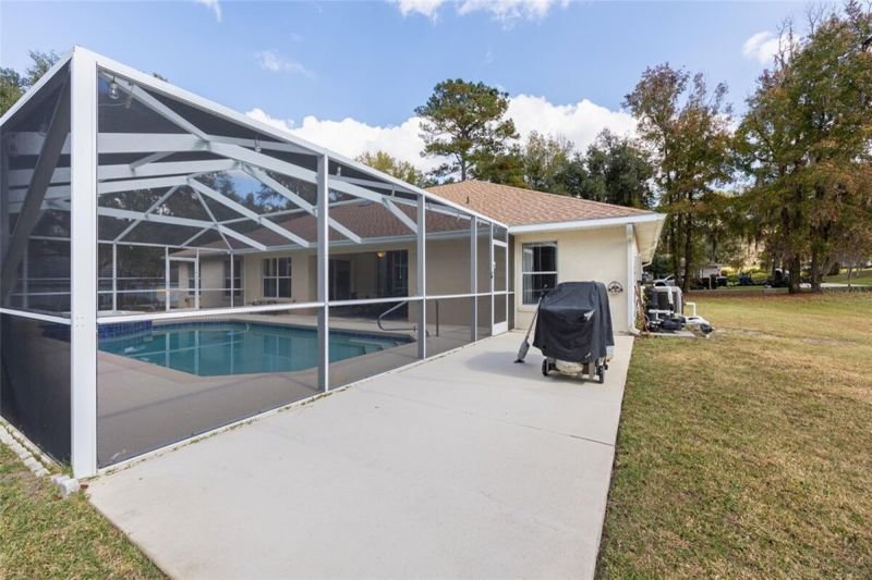 Rear exterior, cage, lawn